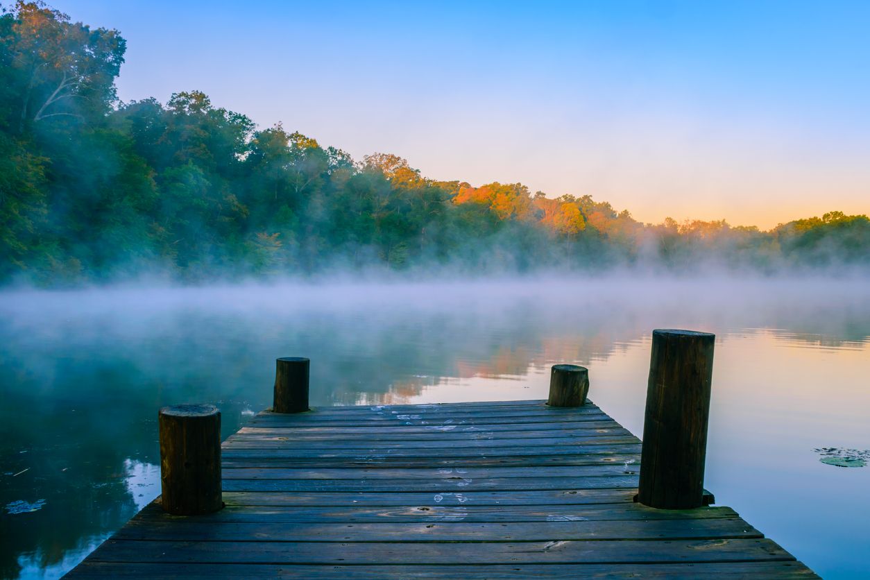 A photo of a lake with a pier.